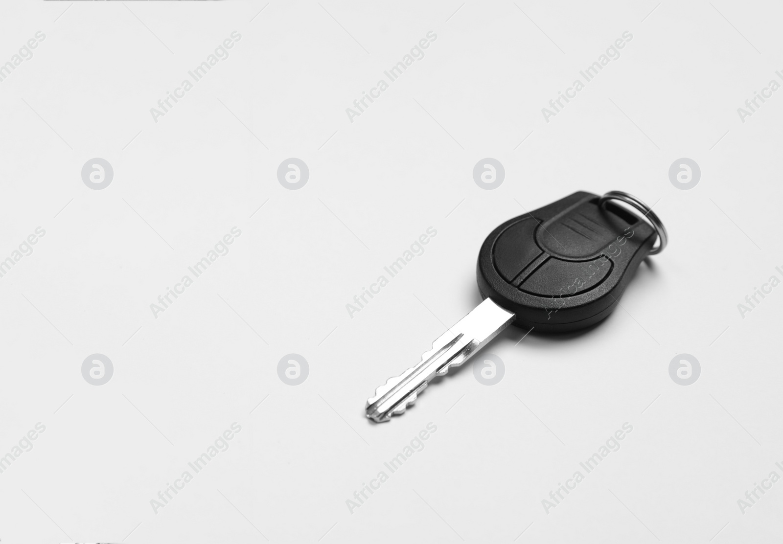 Photo of New modern car key on white background