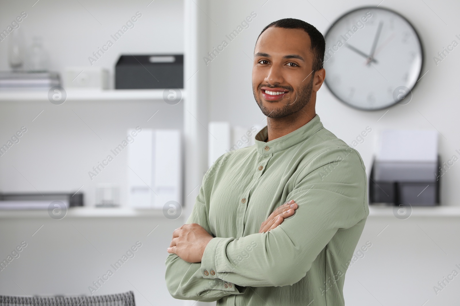 Photo of Portrait of handsome young man indoors, space for text