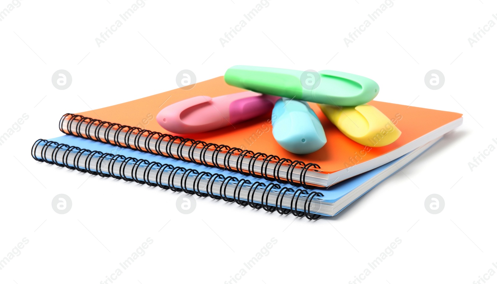 Photo of Notebooks and markers isolated on white. School stationery