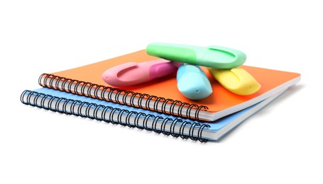 Notebooks and markers isolated on white. School stationery