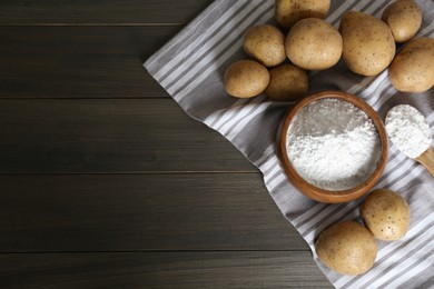 Photo of Starch and fresh raw potatoes on wooden table, flat lay. Space for text