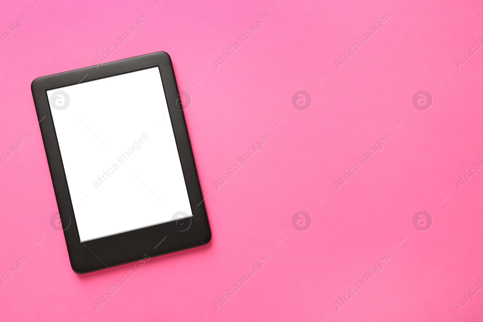 Photo of Modern e-book reader with blank screen on pink background, top view. Space for text