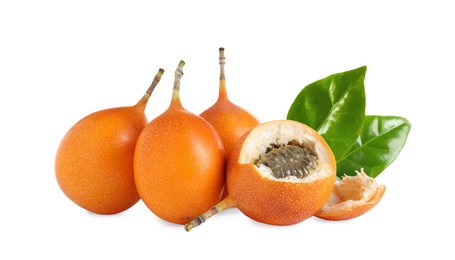 Tasty ripe granadillas and green leaves on white background