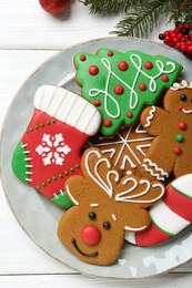 Tasty homemade Christmas cookies on white wooden table, top view