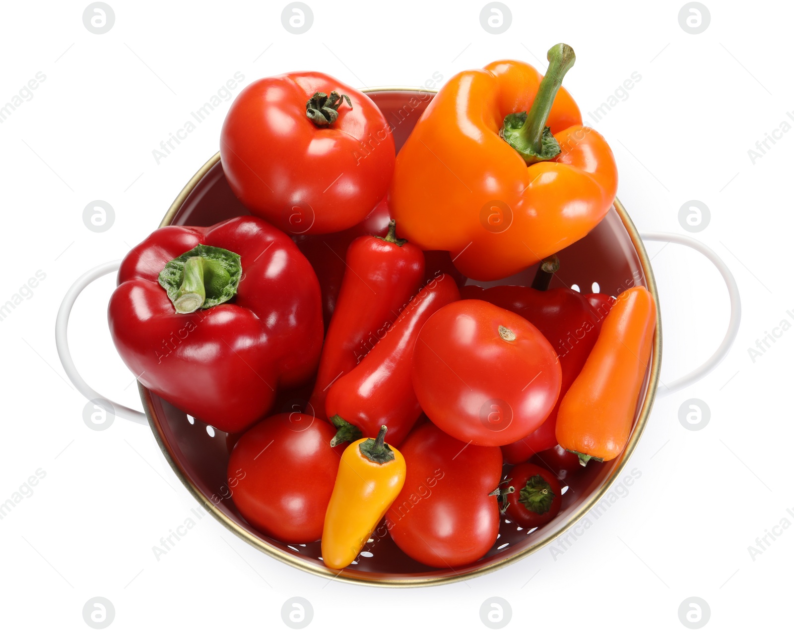 Photo of Colander with fresh vegetables isolated on white, top view