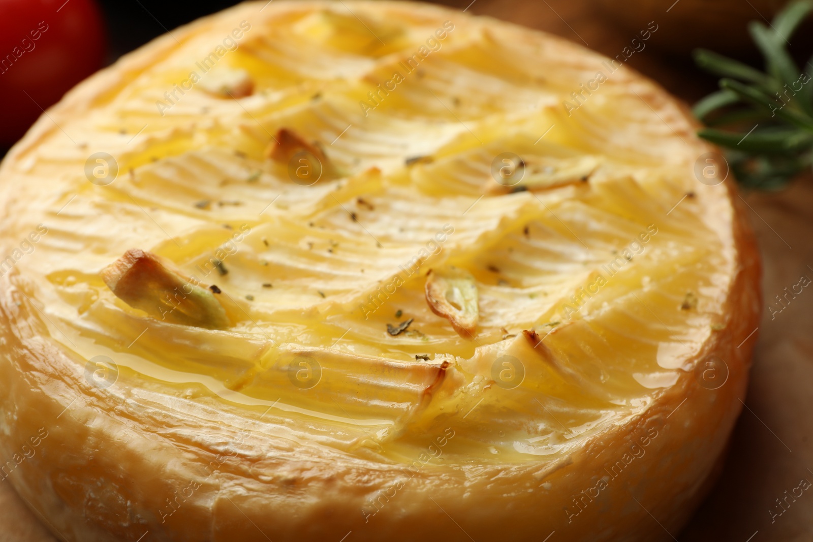 Photo of Closeup view of tasty baked brie cheese