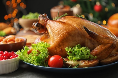 Traditional festive dinner with delicious roasted turkey served on table