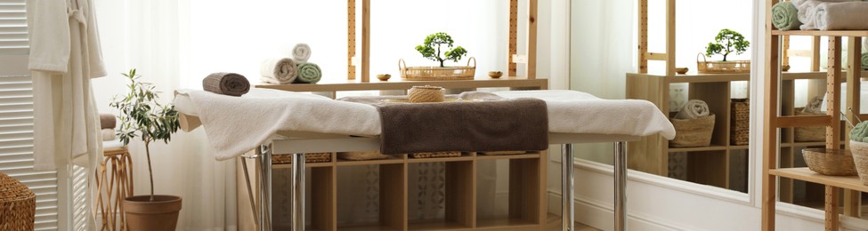 Image of Spa cabinet interior with massage table in wellness center. Banner design