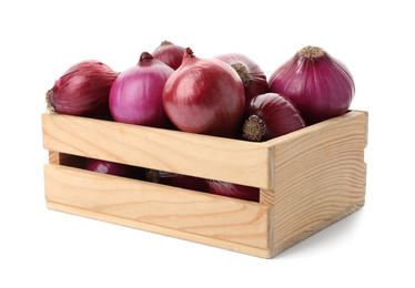 Ripe red onions in wooden crate isolated on white