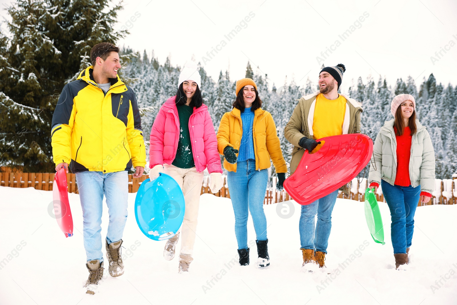 Photo of Group of friends outdoors on snowy day. Winter vacation
