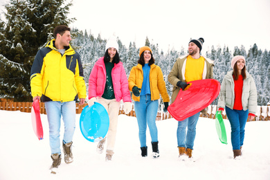 Group of friends outdoors on snowy day. Winter vacation