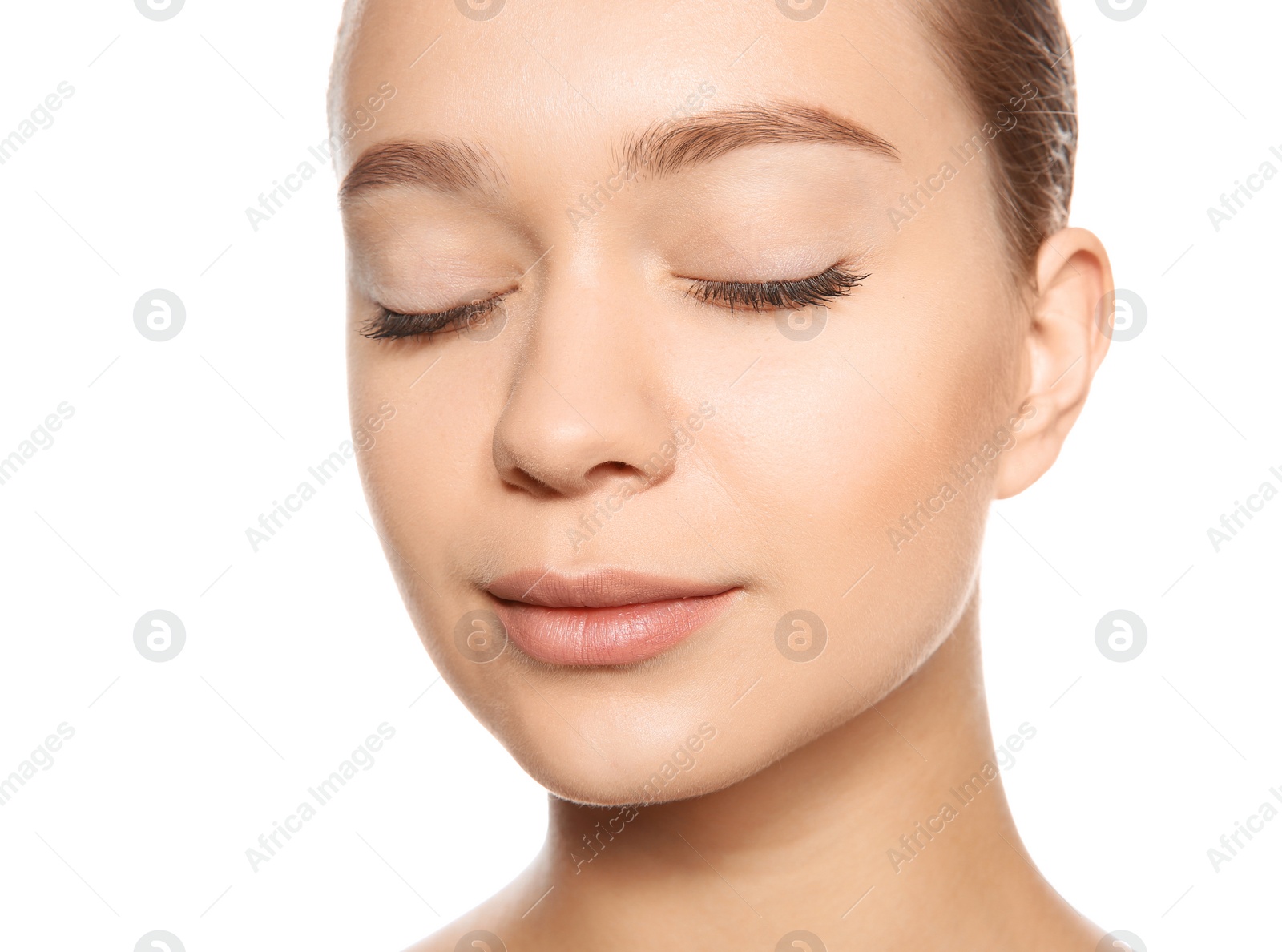 Photo of Portrait of young woman with foundation on her face against white background