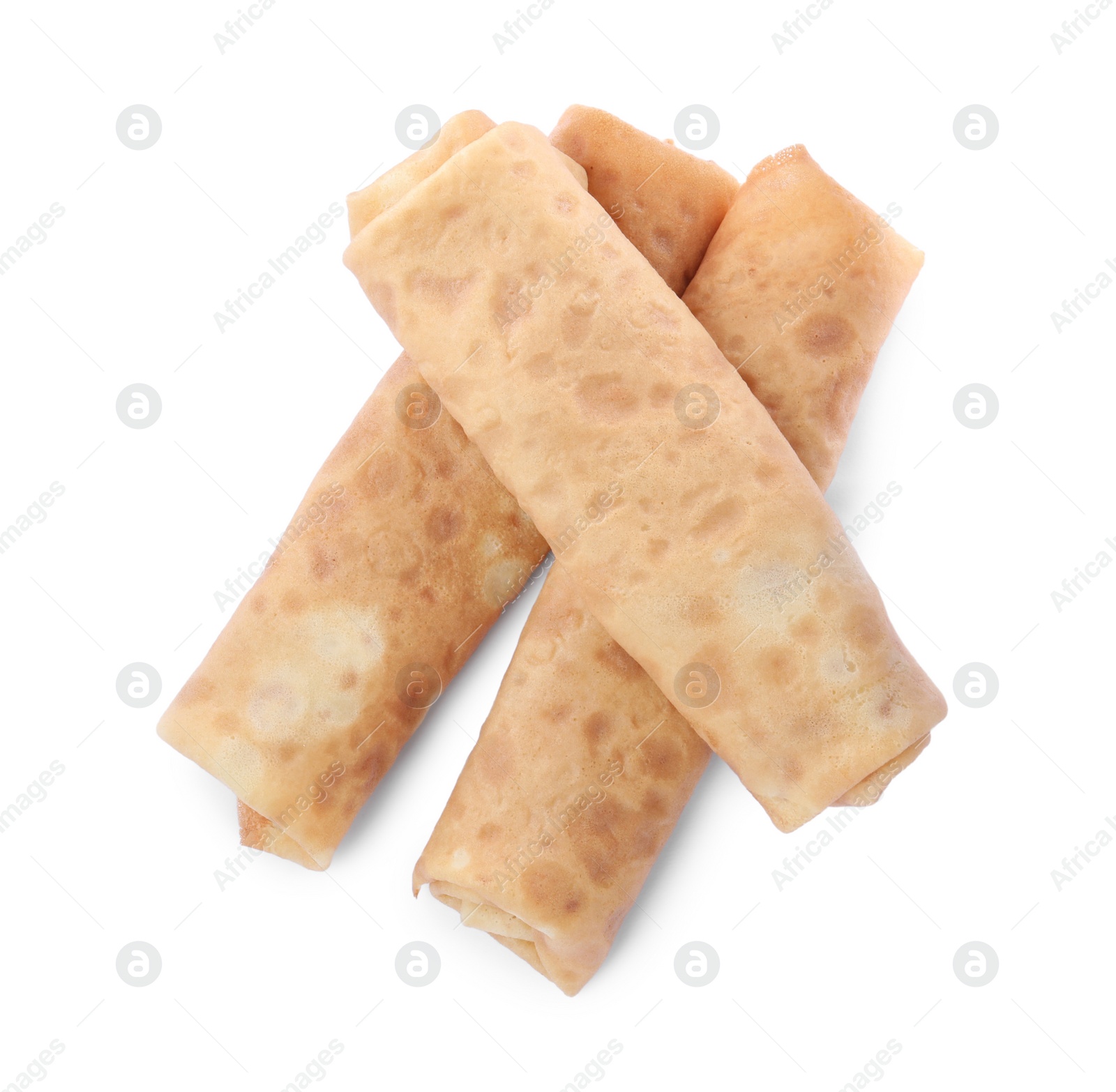 Photo of Delicious rolled crepes on white background, top view