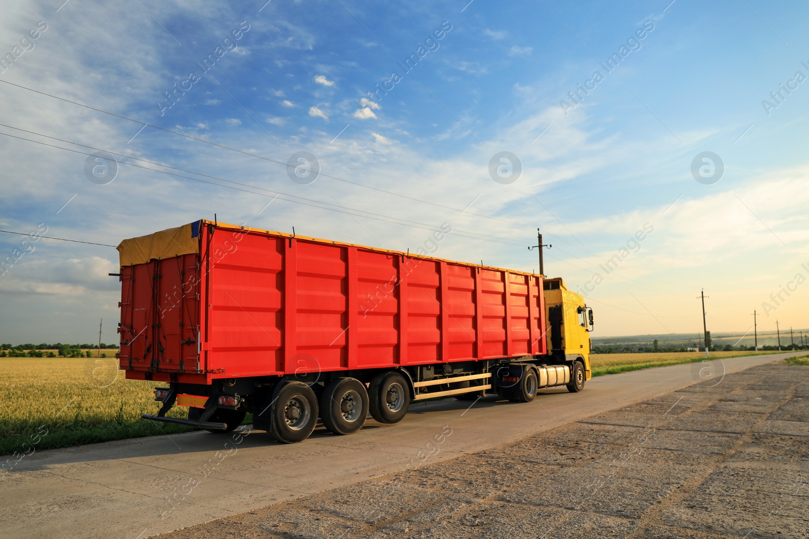 Photo of Modern bright truck parked on country road