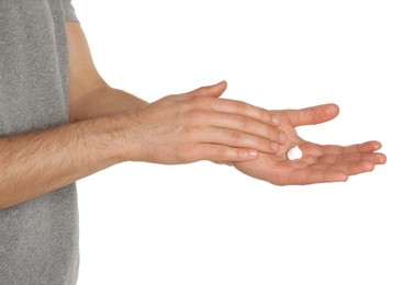 Man applying cream onto hand against white background, closeup