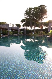 Outdoor swimming pool at resort, blurred view