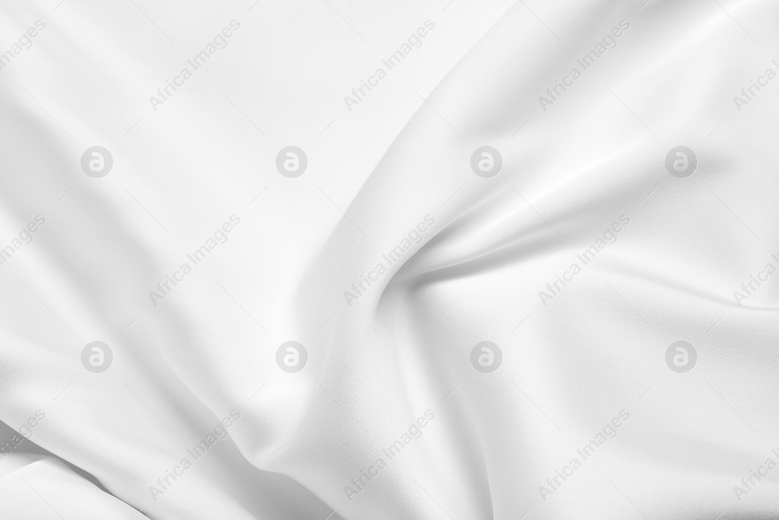 Photo of Texture of white silk ripple fabric as background, top view