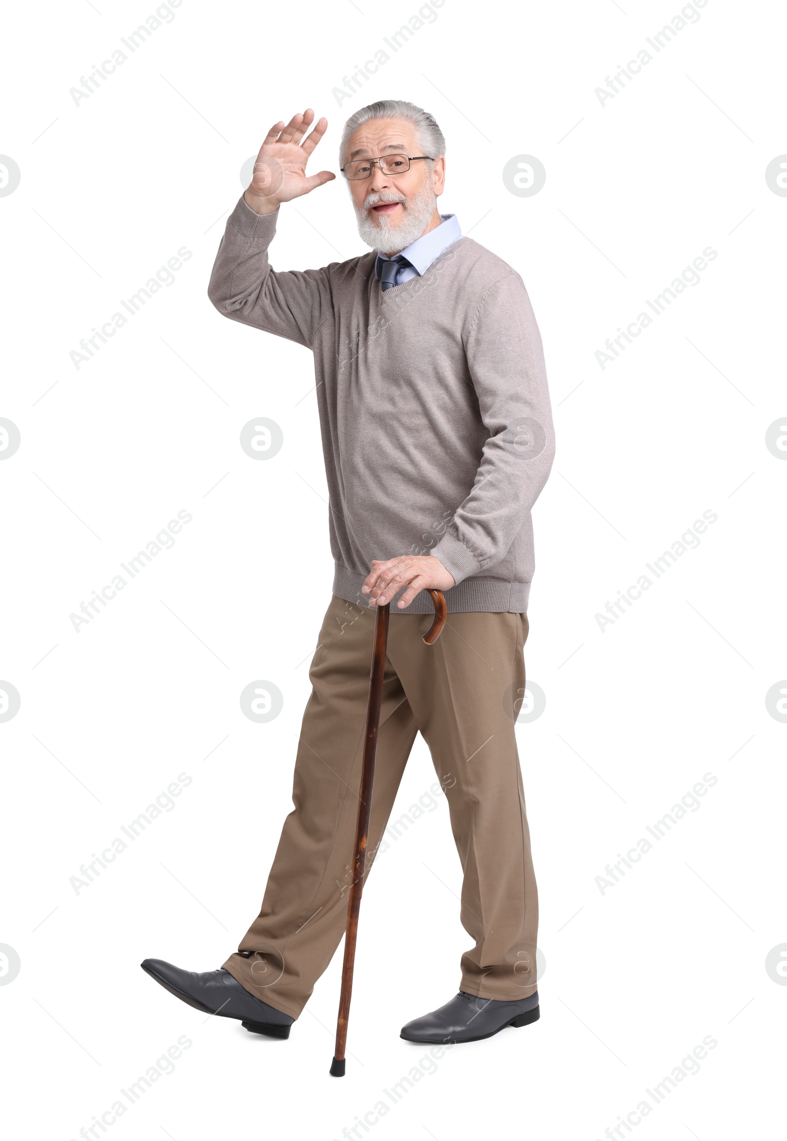 Photo of Senior man with walking cane waving on white background