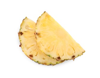 Photo of Slices of tasty ripe pineapple isolated on white, top view