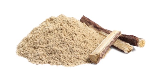 Dried sticks of liquorice root and powder on white background