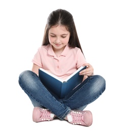 Photo of Cute little girl reading book on white background