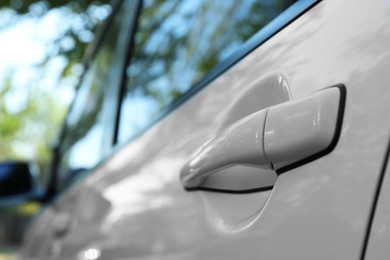 Closeup view of car door with handle