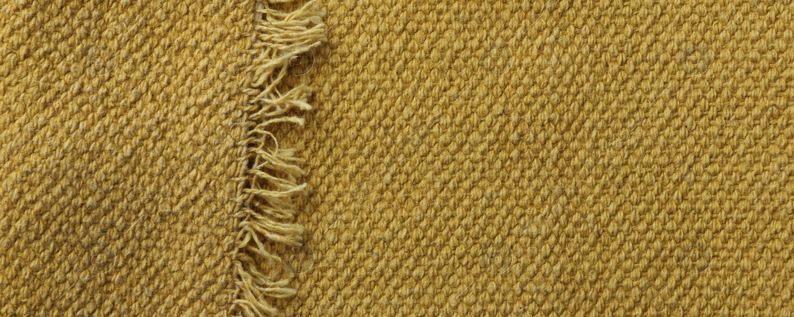 Photo of Texture of golden color fabric as background, top view