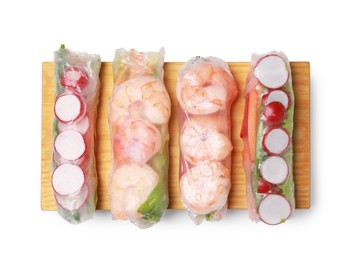 Different delicious spring rolls wrapped in rice paper on white background, top view
