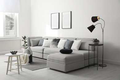 Photo of Stylish living room interior with comfortable sofa