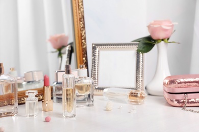 Photo of Perfume bottles on dressing table