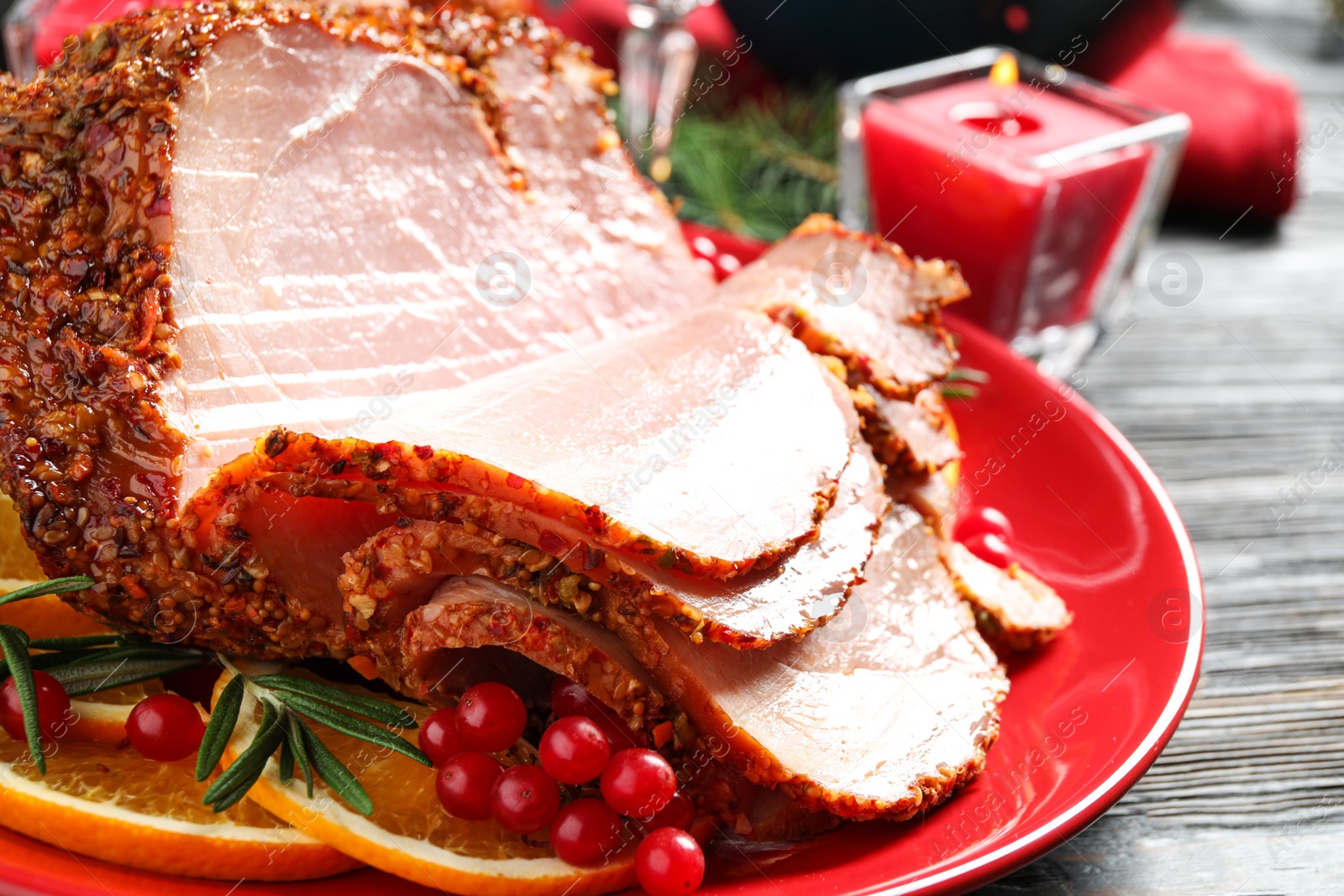 Photo of Plate with delicious ham served on dark wooden table, closeup. Christmas dinner