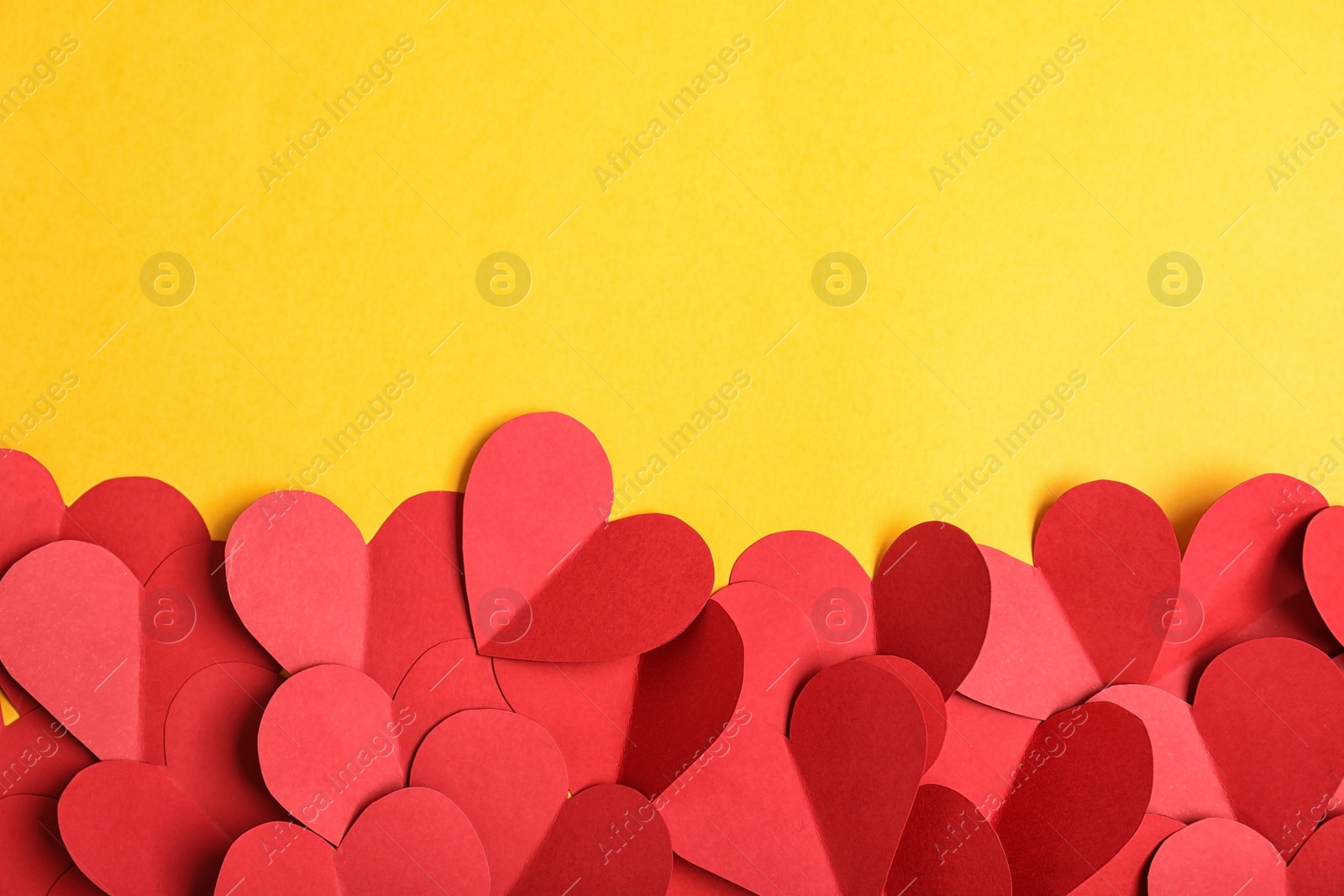 Photo of Flat lay composition with paper hearts and space for text on color background