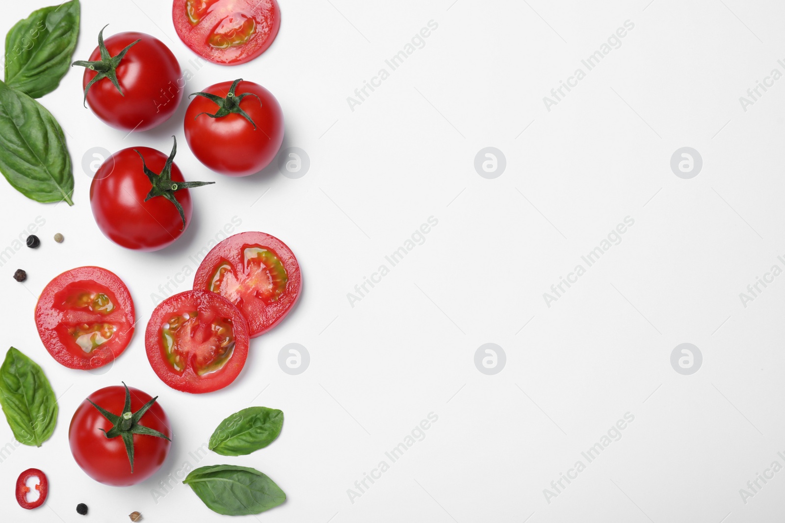 Photo of Composition with fresh basil leaves and tomatoes on white background, flat lay. Space for text