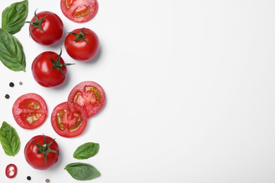 Composition with fresh basil leaves and tomatoes on white background, flat lay. Space for text