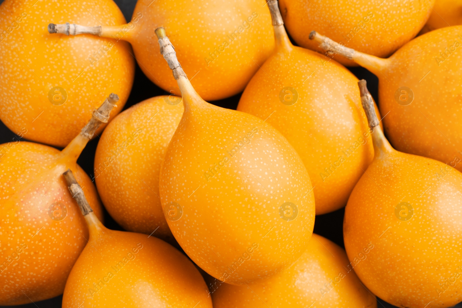 Photo of Delicious ripe granadillas as background, closeup view