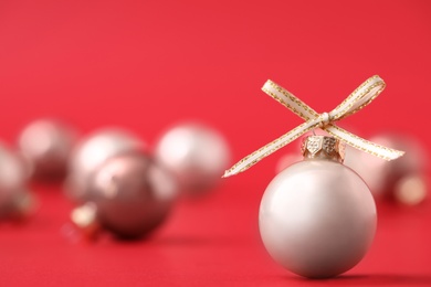 Beautiful Christmas balls on red background. Space for text