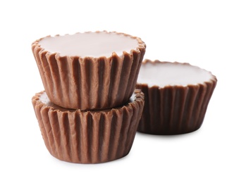 Photo of Delicious peanut butter cups on white background