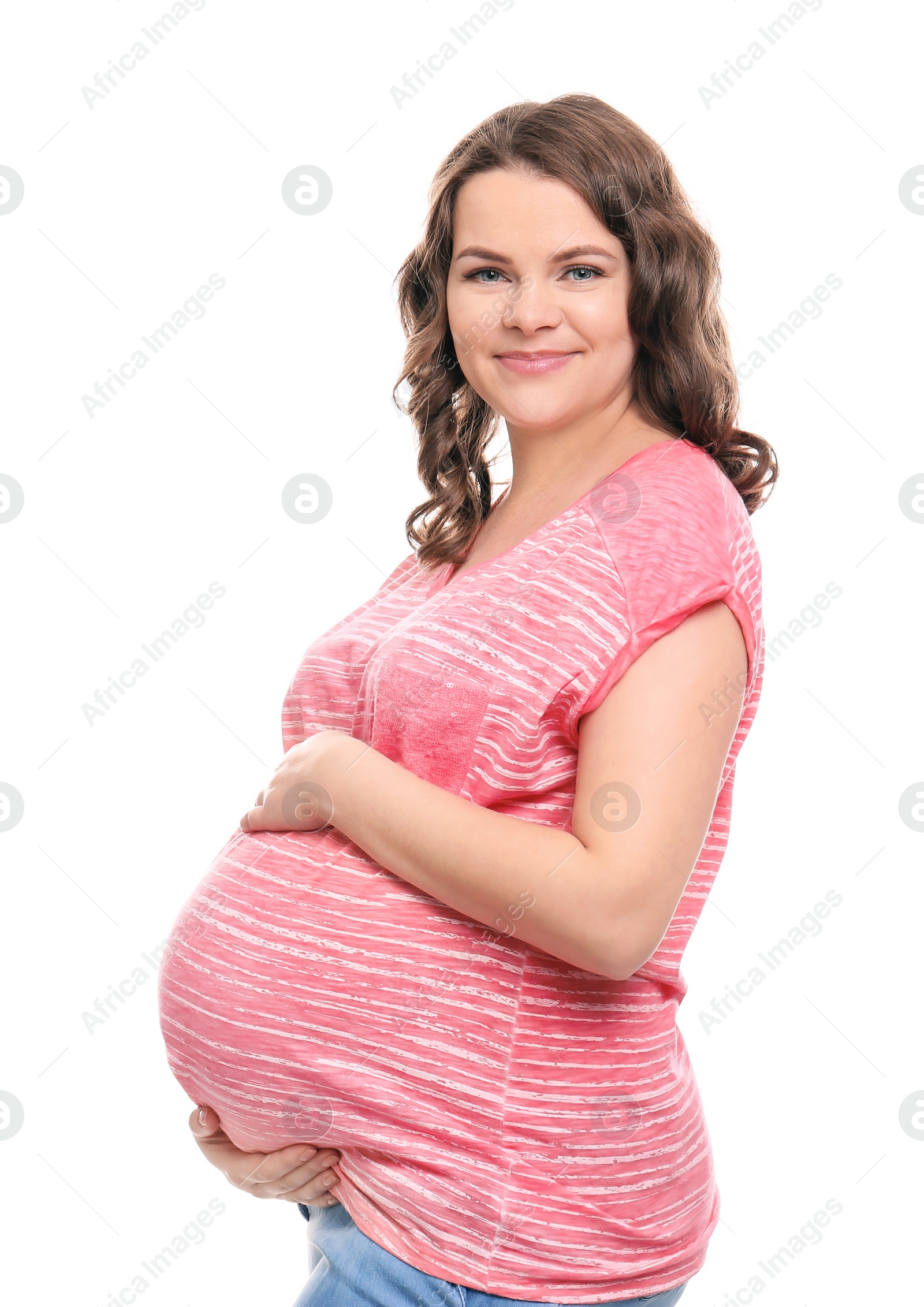 Photo of Young pregnant woman in casual clothes on white background