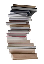 Photo of High stack of many different books isolated on white