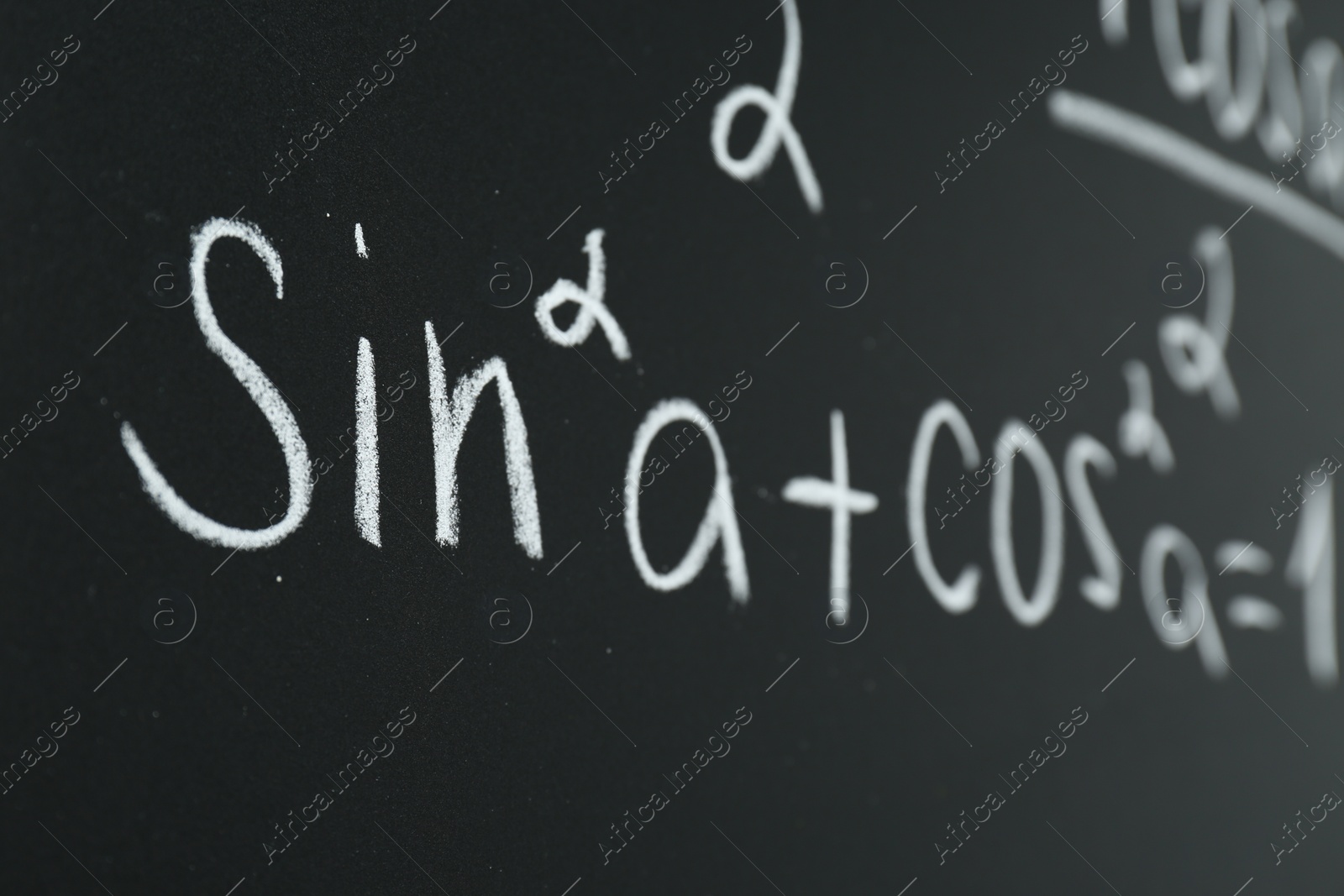 Photo of Math formula written on chalkboard, closeup view