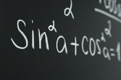 Photo of Math formula written on chalkboard, closeup view