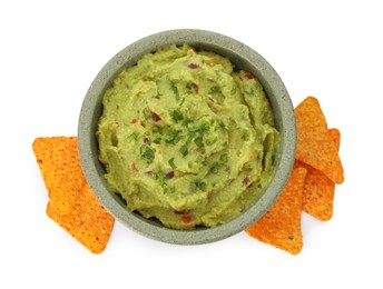 Bowl of delicious guacamole and nachos chips isolated on white, top view