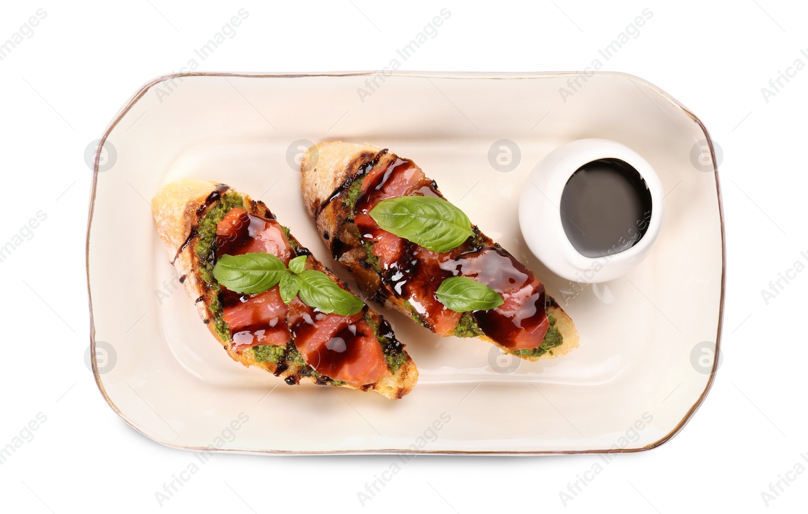 Photo of Delicious bruschettas with balsamic vinegar and toppings isolated on white, top view