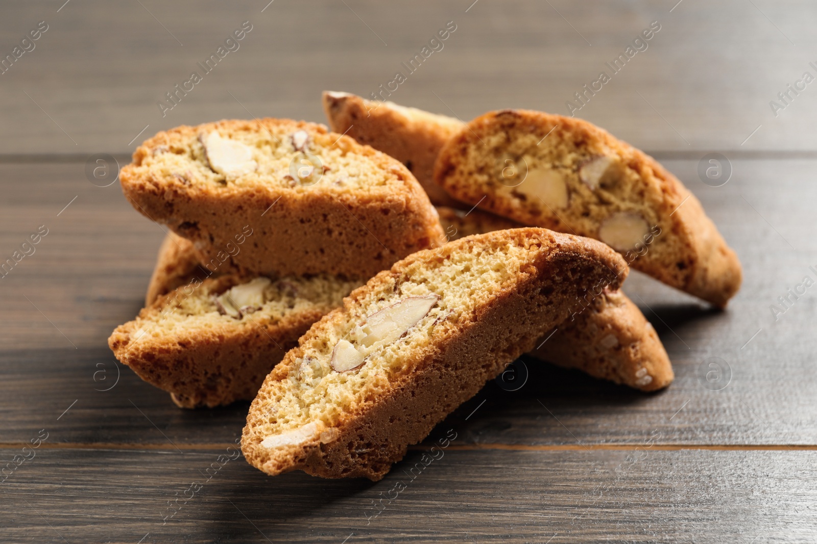 Photo of Traditional Italian almond biscuits (Cantucci) on wooden table