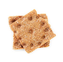 Photo of Pieces of crunchy rye crispbread on white background, top view