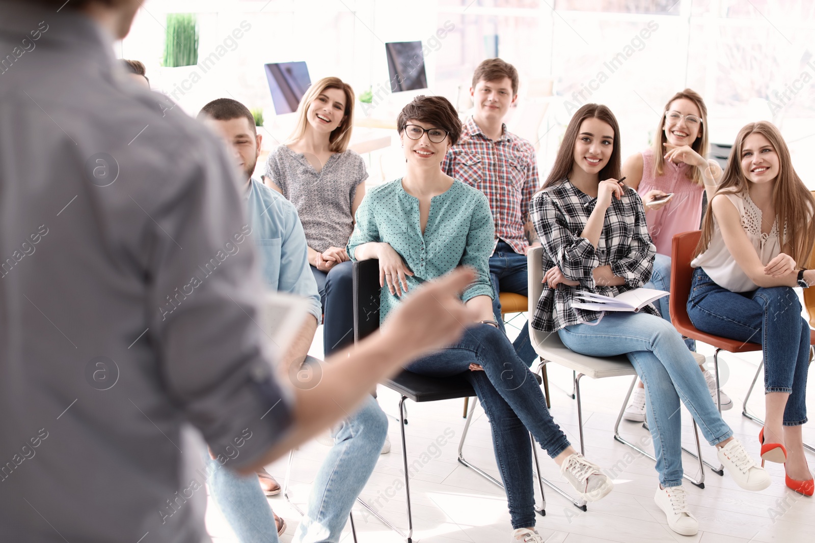 Photo of Young people having business training in office