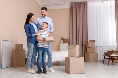 Photo of Happy family spending time in new apartment. Moving day