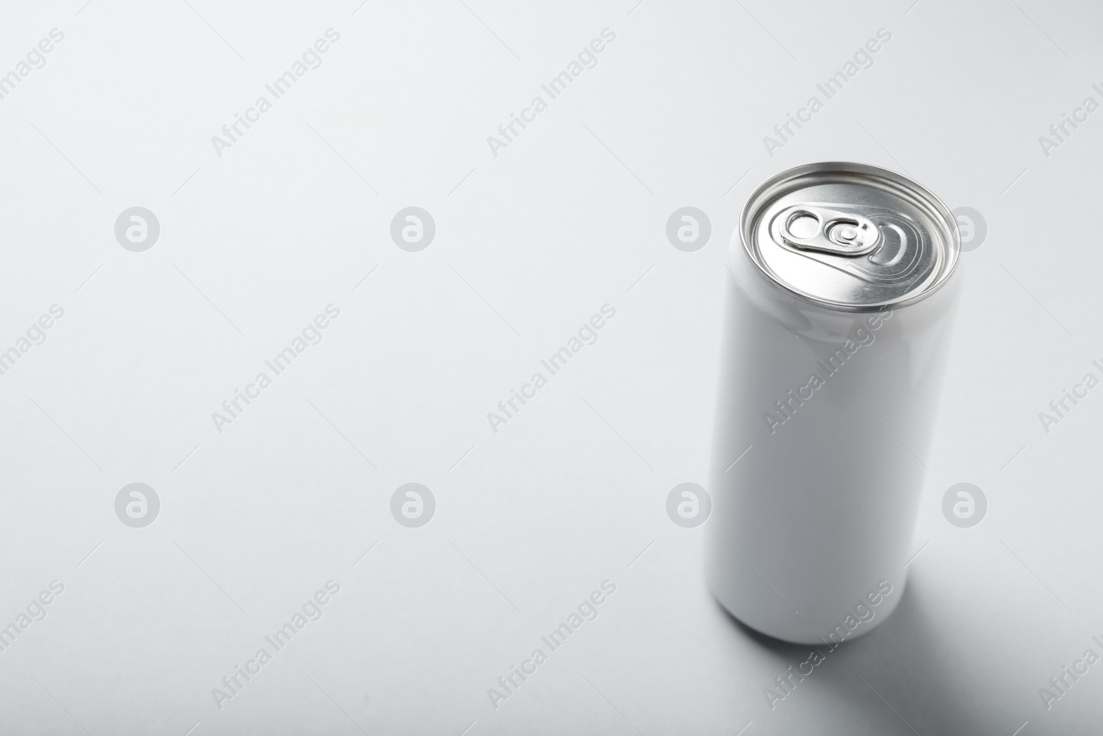 Photo of Can of energy drink on white background. Space for text