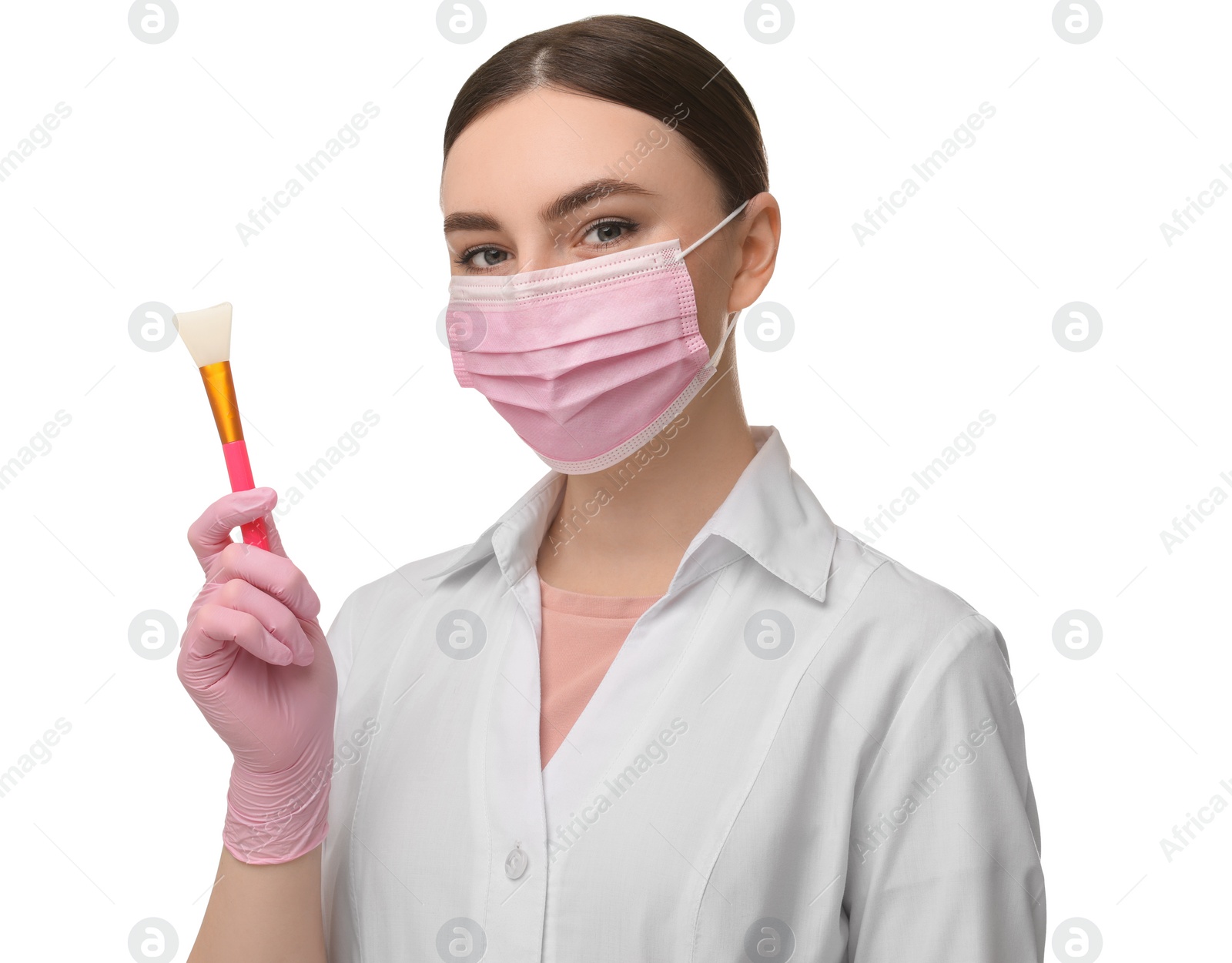 Photo of Cosmetologist with silicone cosmetic brush on white background