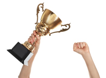 Photo of Young woman holding gold trophy cup on white background, closeup